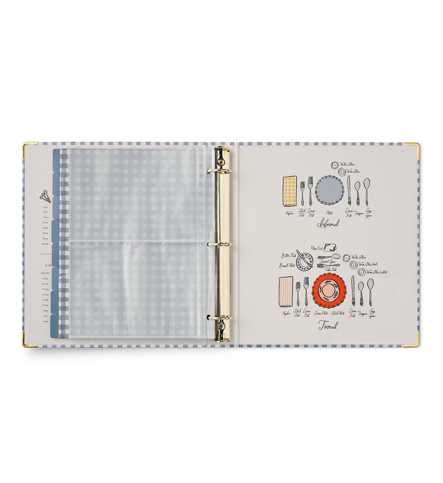 Rifle Paper Co. Home Sweet Home Recipe Binder open to clear pocket page on left and illustrated table setting reference guide on right showing informal and formal place settings with labeled utensils and plates