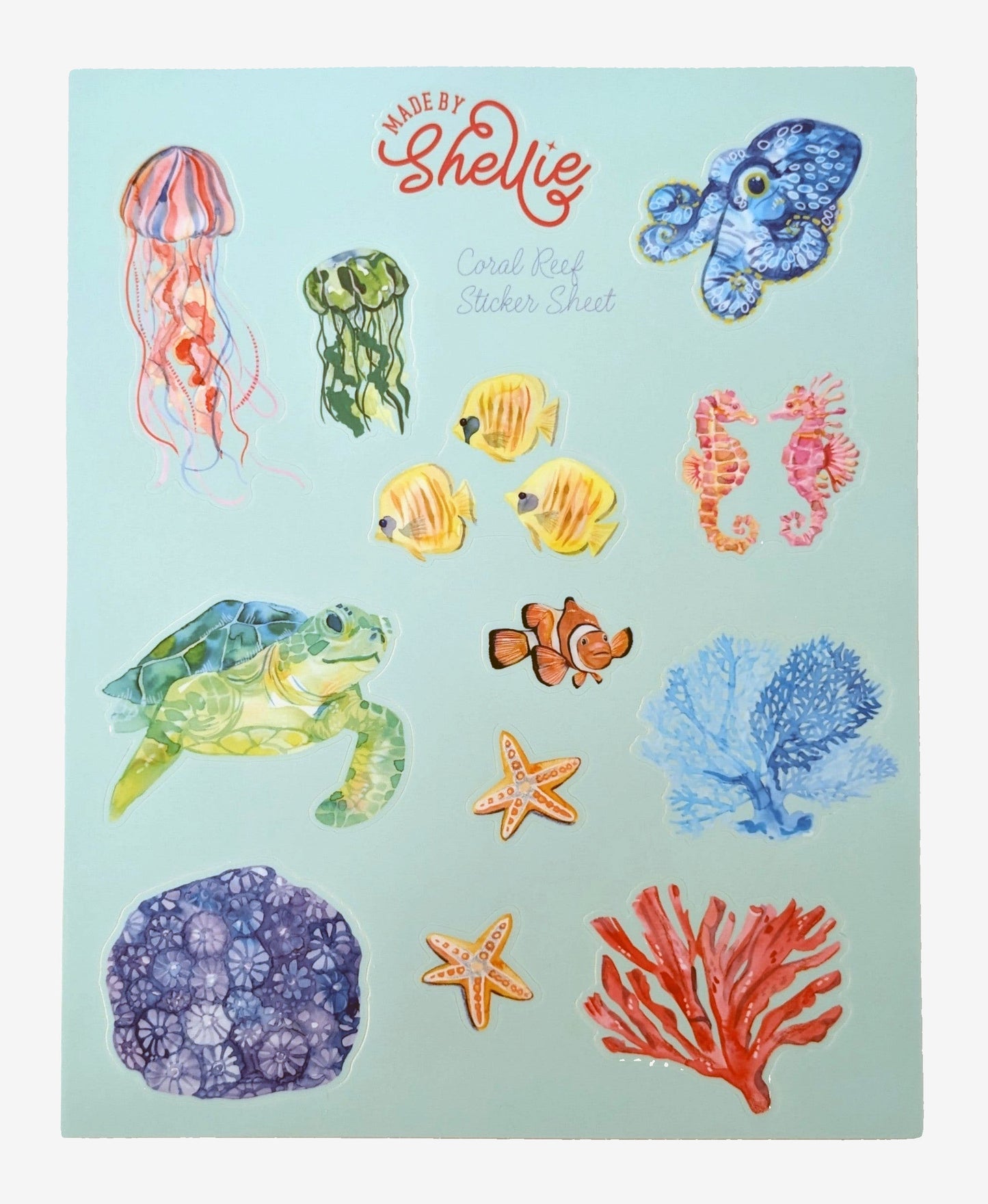 Made by Shellie Coral Reef Sticker Sheet — 14 watercolor die-cut ocean stickers on mint blue sheet including pink jellyfish, green seaweed, blue octopus, two yellow tropical fish, two pink seahorses, green sea turtle, clownfish, two orange starfish, blue fan coral, purple brain coral, and red coral branch; white background