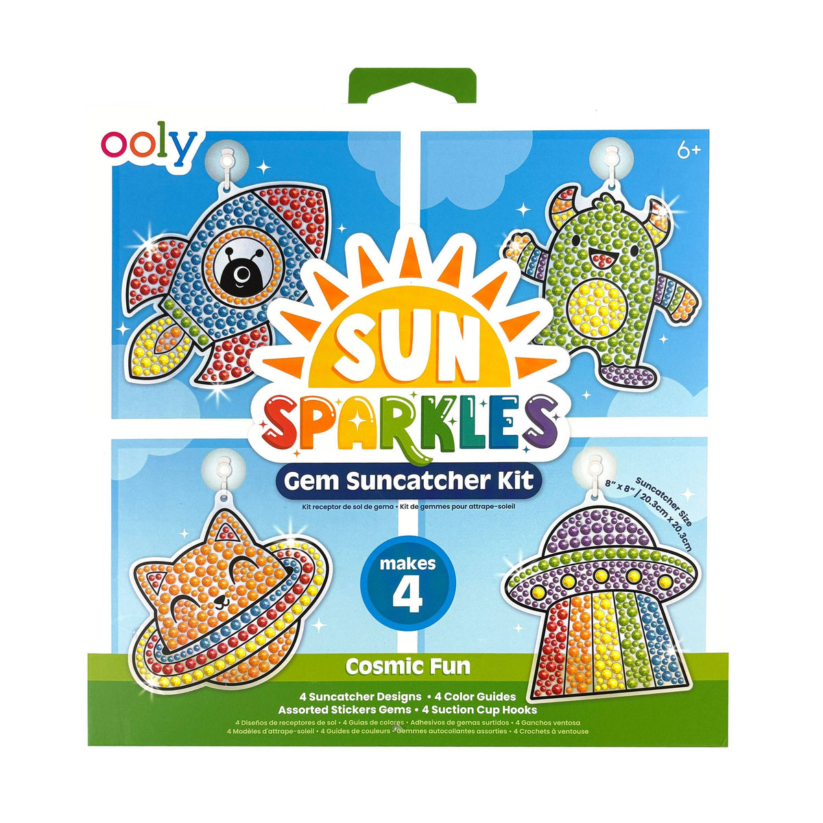 OOLY Sun Sparkles Cosmic Fun Gem Suncatcher Kit front packaging showing completed gem rocket, alien, space cat with planet ring, and UFO suncatchers on a blue sky background — "makes 4," ages 6+, 8"x8" suncatcher size