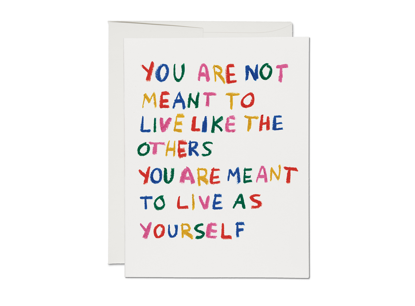 Red Cap Cards Be Yourself Encouragement Card — bold multicolored hand-lettered text reading "You Are Not Meant to Live Like the Others. You Are Meant to Live as Yourself" in rainbow colors on a white card; white envelope shown behind; white background