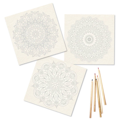 Three Elseware Unplug mandala coloring sheets fanned out on white background — each 9x9 inch sheet printed on warm ivory 110lb watercolor paper with lightly printed intricate mandala outlines; designs include a large floral petal mandala, a circular geometric mandala, and a star-centered mandala; four colored pencils fanned beside the sheets