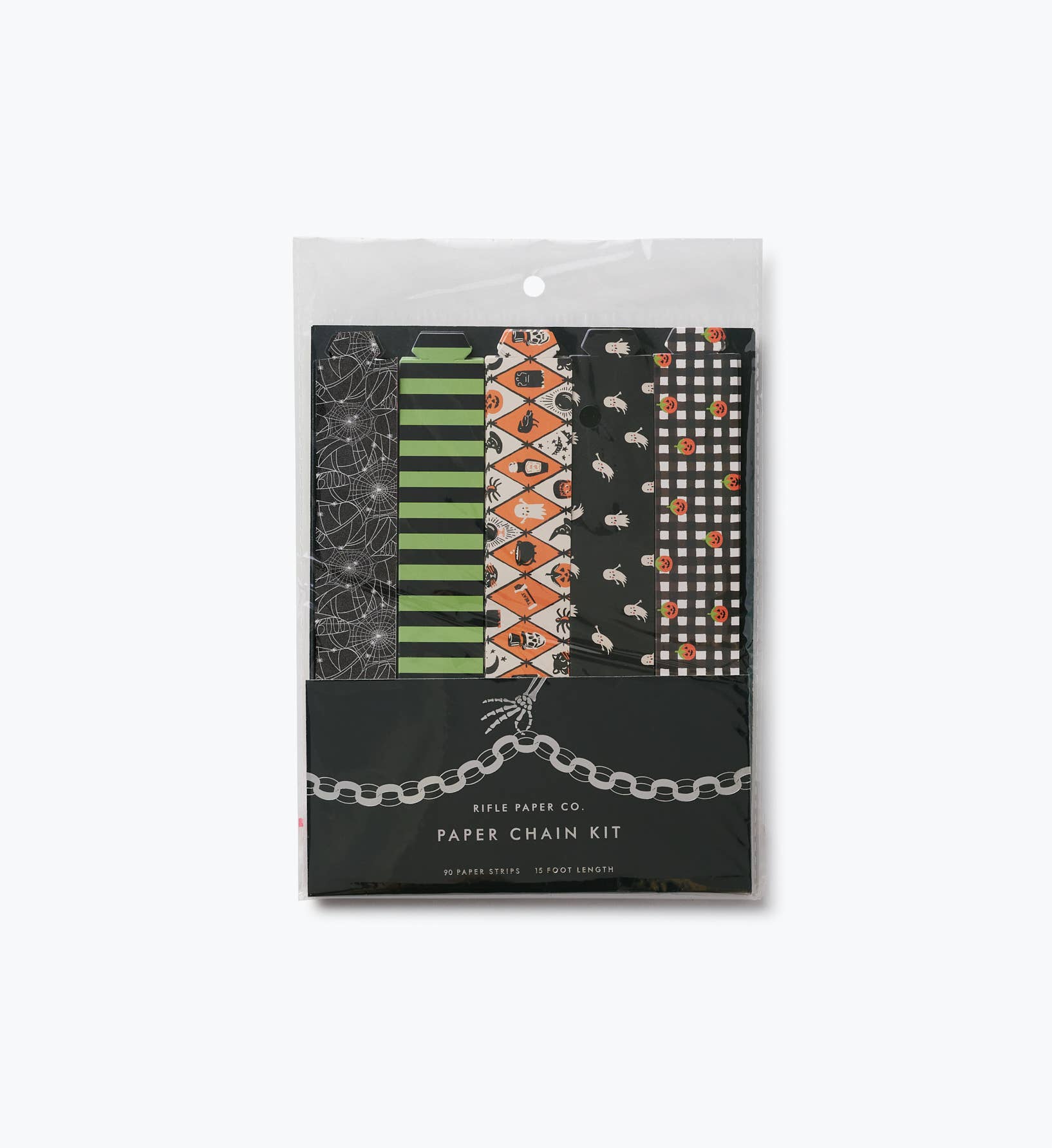 Rifle Paper Co. Halloween Paper Chain Kit packaging — clear bag with 5 Halloween pattern strips: spiderweb, green stripe, orange argyle, ghost on black, and gingham with pumpkins; black "Paper Chain Kit" label; 90 strips, 15 foot length; white background