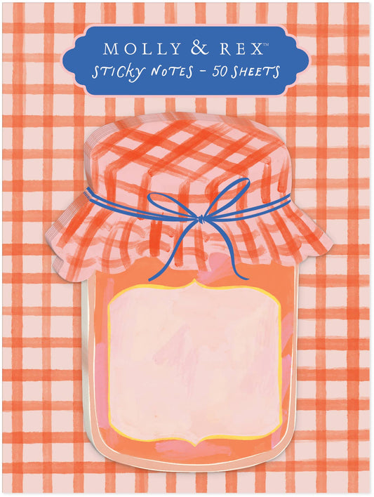 Molly & Rex Pepper Jam die-cut sticky notepad on orange gingham backer card — 50-sheet notepad die-cut in the shape of a jam jar; watercolor illustration features a gingham fabric cap in orange and pink tied with a blue bow, round jar body with blank yellow-framed label; backer card reads "Molly & Rex Sticky Notes – 50 Sheets" in navy on cream plaque at top