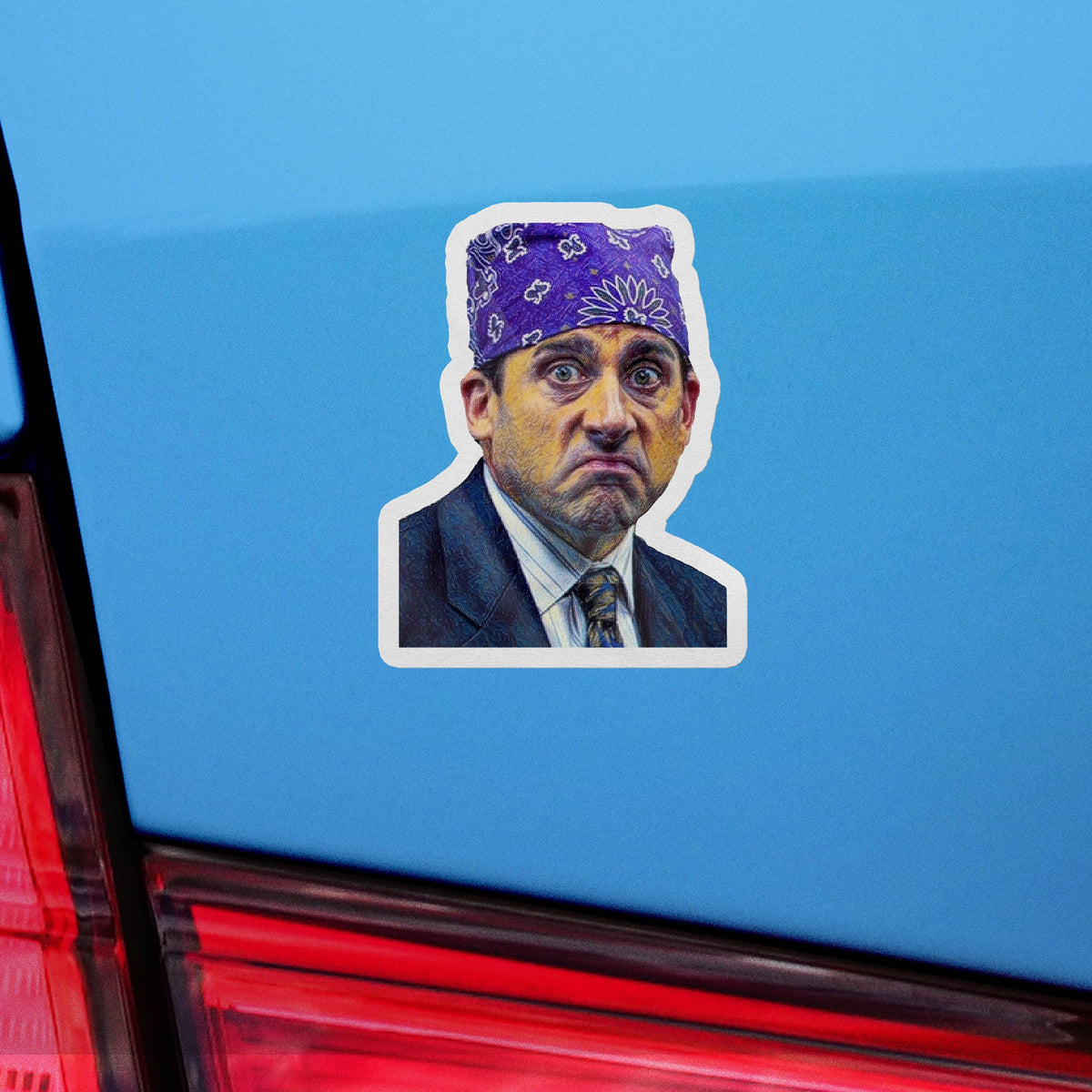 Sticker Bull Prison Mike The Office die cut vinyl sticker applied to a light blue car bumper panel — illustrated Michael Scott as Prison Mike in purple paisley bandana with stern grimace expression; white die cut border