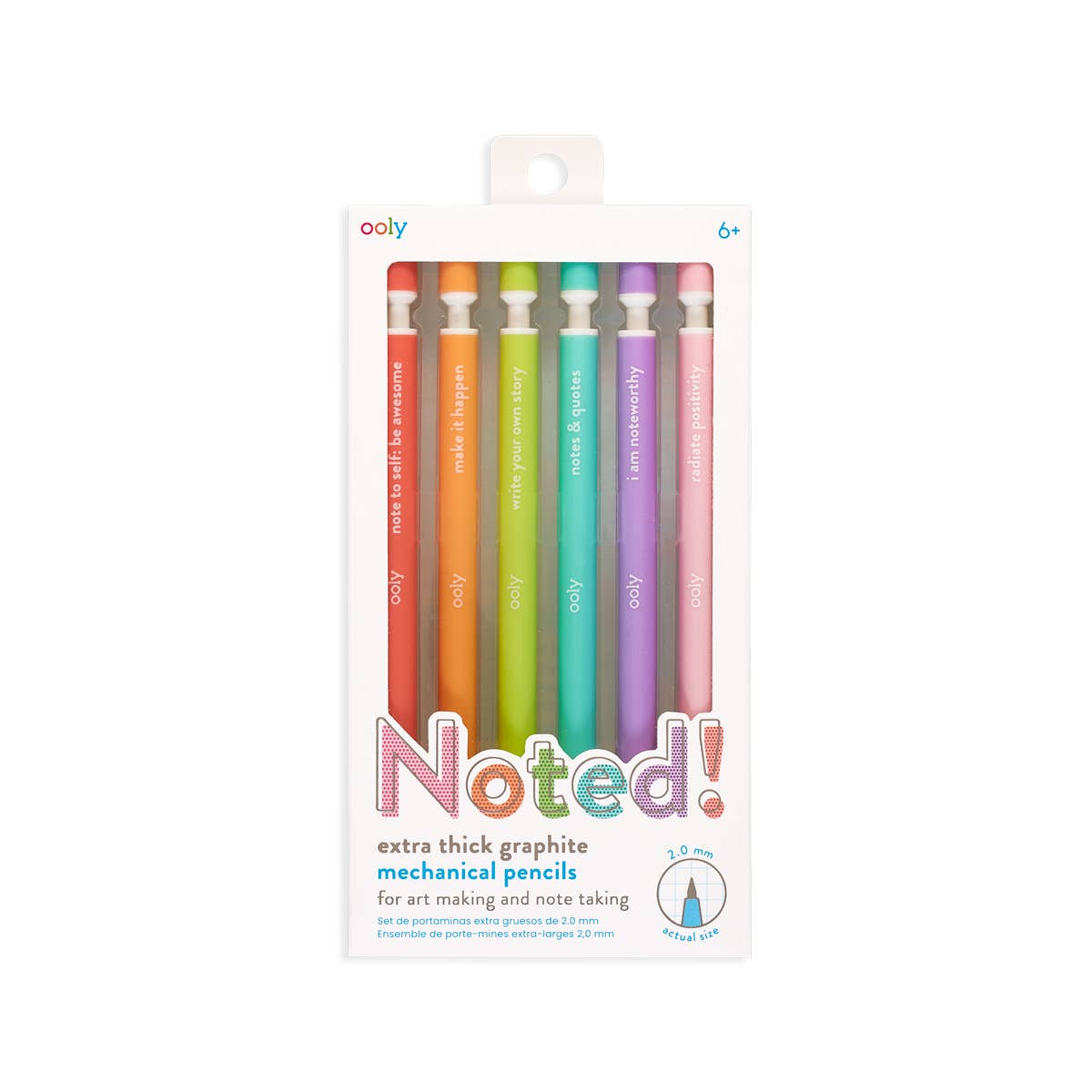 OOLY Noted! Extra Thick Graphite Mechanical Pencils set of 6 in retail packaging on white background — clear-front white box with hang tab; six pencils in rainbow order: red, orange, lime green, teal, purple, and pink; each with a colored sharpener cap and motivating quote in white text; "Noted!" in multicolor lettering at bottom; "extra thick graphite mechanical pencils" subtitle; ooly logo and 6+ age label at top