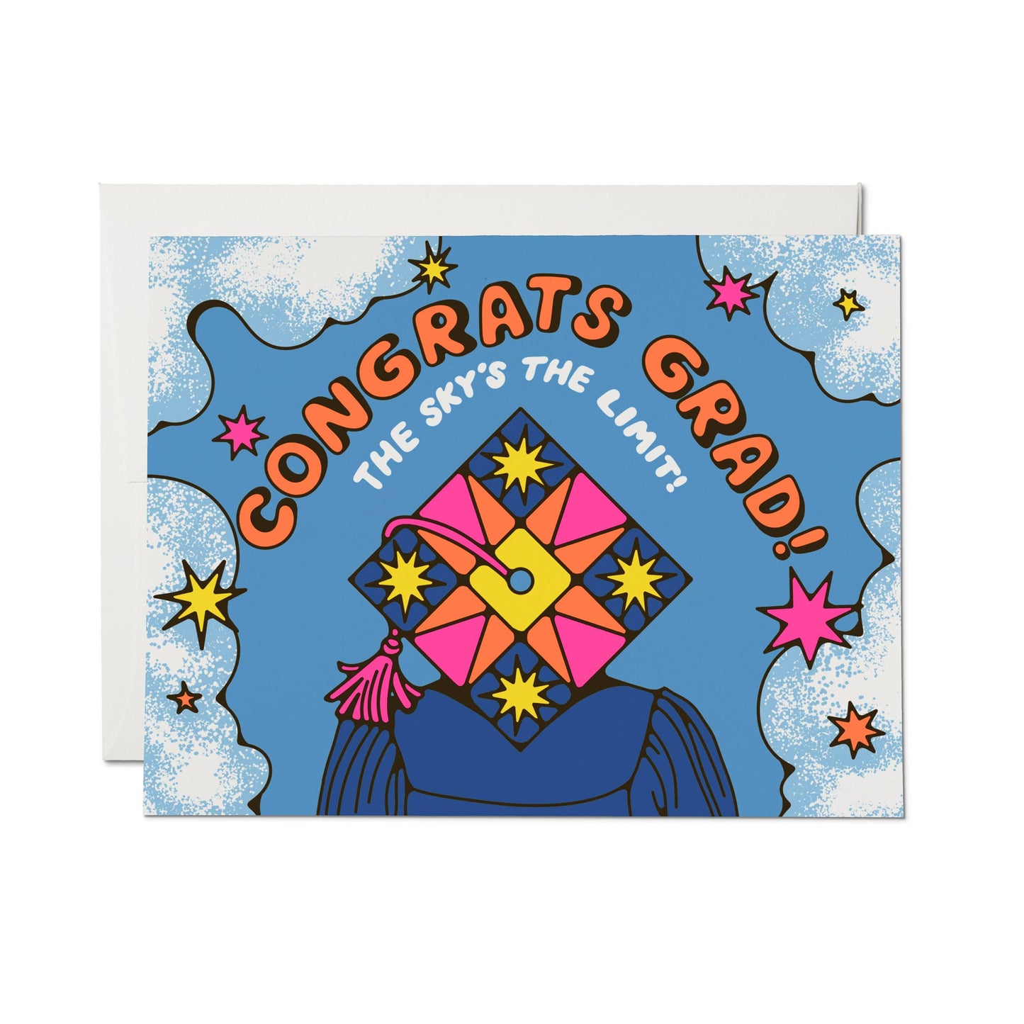 Red Cap Cards Sky's the Limit Graduation Greeting Card — illustrated card with bold "Congrats Grad! The Sky's the Limit!" text on a blue sky background with clouds, colorful stars, and a decorated graduation cap with pink tassel; white envelope shown behind; white background