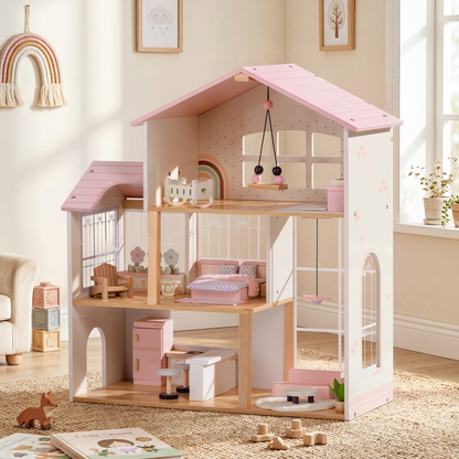 Robud 3-story pink and cream wooden dollhouse in a sunlit Scandinavian children's room — framed botanical prints on white walls; tower sunroom with lattice window on left; children's room, bedroom, and kitchen across 3 floors; loose wooden toys and a children's book on the floor in the foreground