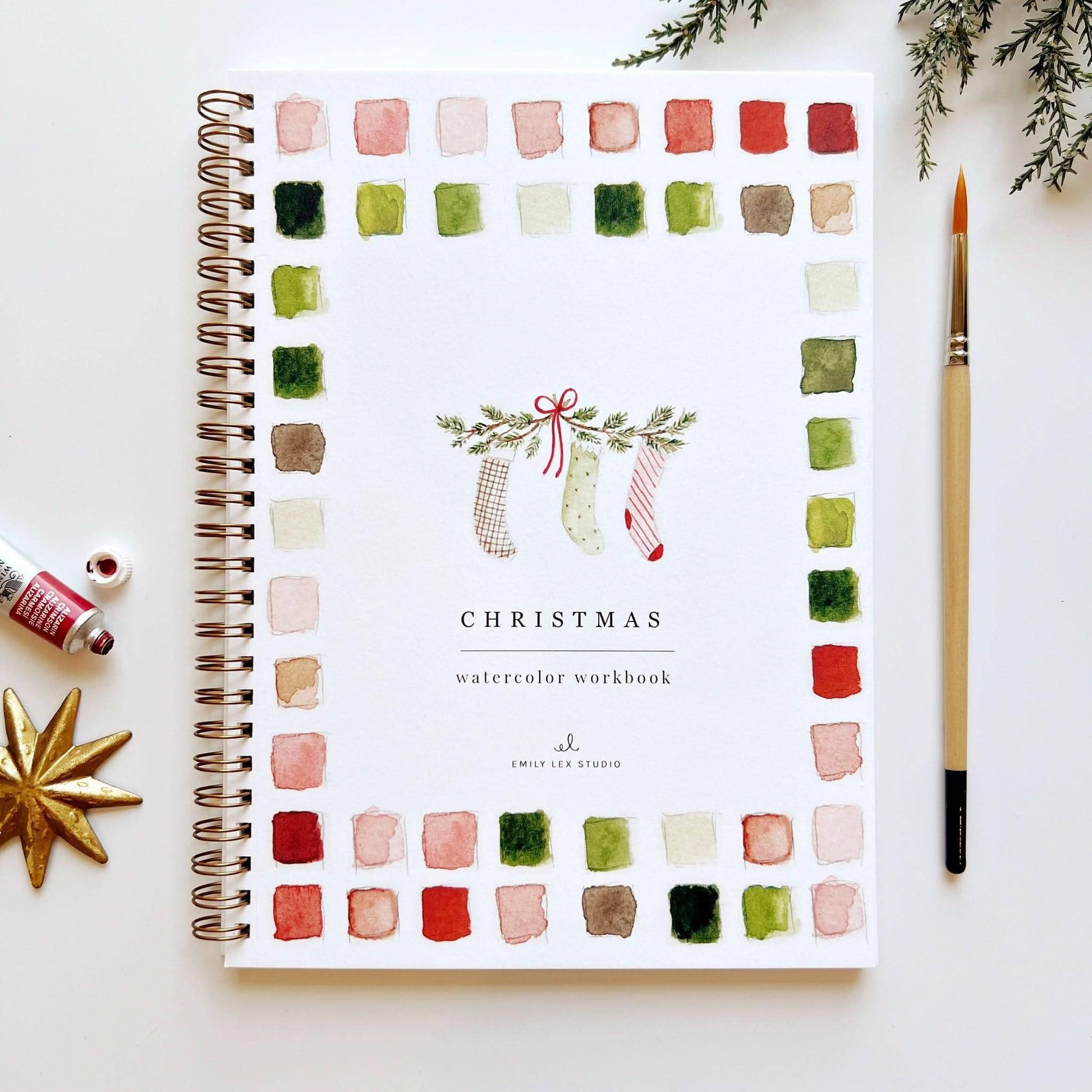 Christmas Watercolor Workbook by Emily Lex Studio — spiral-bound beginner watercolor painting book with a Christmas illustration on the cover, bordered by red and green watercolor swatches
