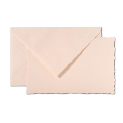 G. Lalo Vergé de France card and envelope set in blush rose — deckle-edged flat card stacked with matching blush tissue-lined envelope on white background; diagonal euro flap open; deckle edge detail visible on card bottom