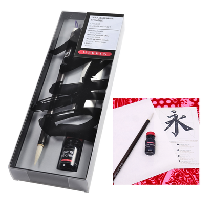 J. Herbin Chinese Calligraphy gift set shown two ways on white background — left: set open in dark display box showing Chinese brush, Encre de Chine ink bottle with red cap, and black calligraphy script backdrop; right: lifestyle inset showing brush, ink bottle, and a sheet of parchment with a large Chinese character painted in black ink, red patterned surface beneath