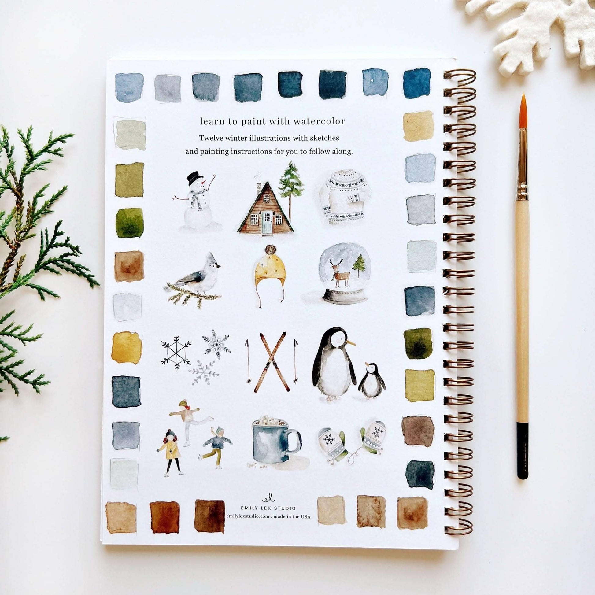 Back cover of Winter Watercolor Workbook by Emily Lex Studio showing all 12 winter illustrations with watercolor swatches border