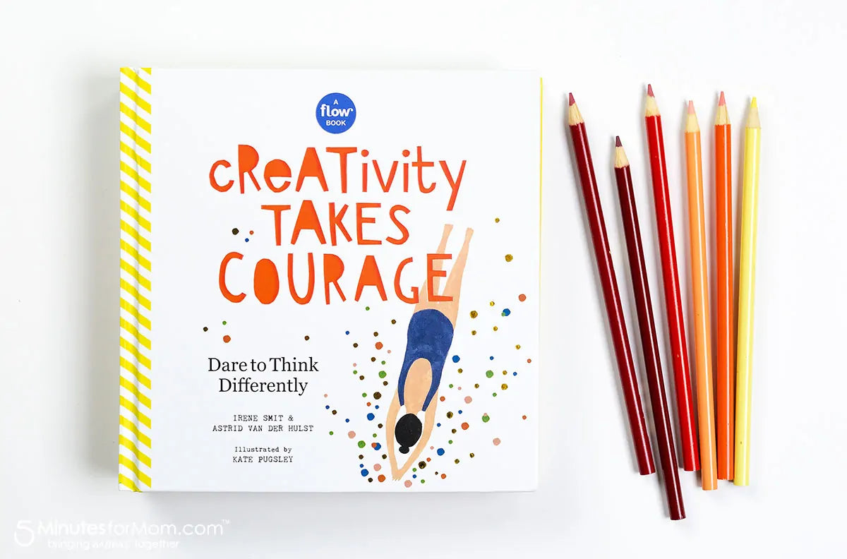 Flat lay of Creativity Takes Courage book cover beside five colored pencils in red, orange, and yellow tones on a white background