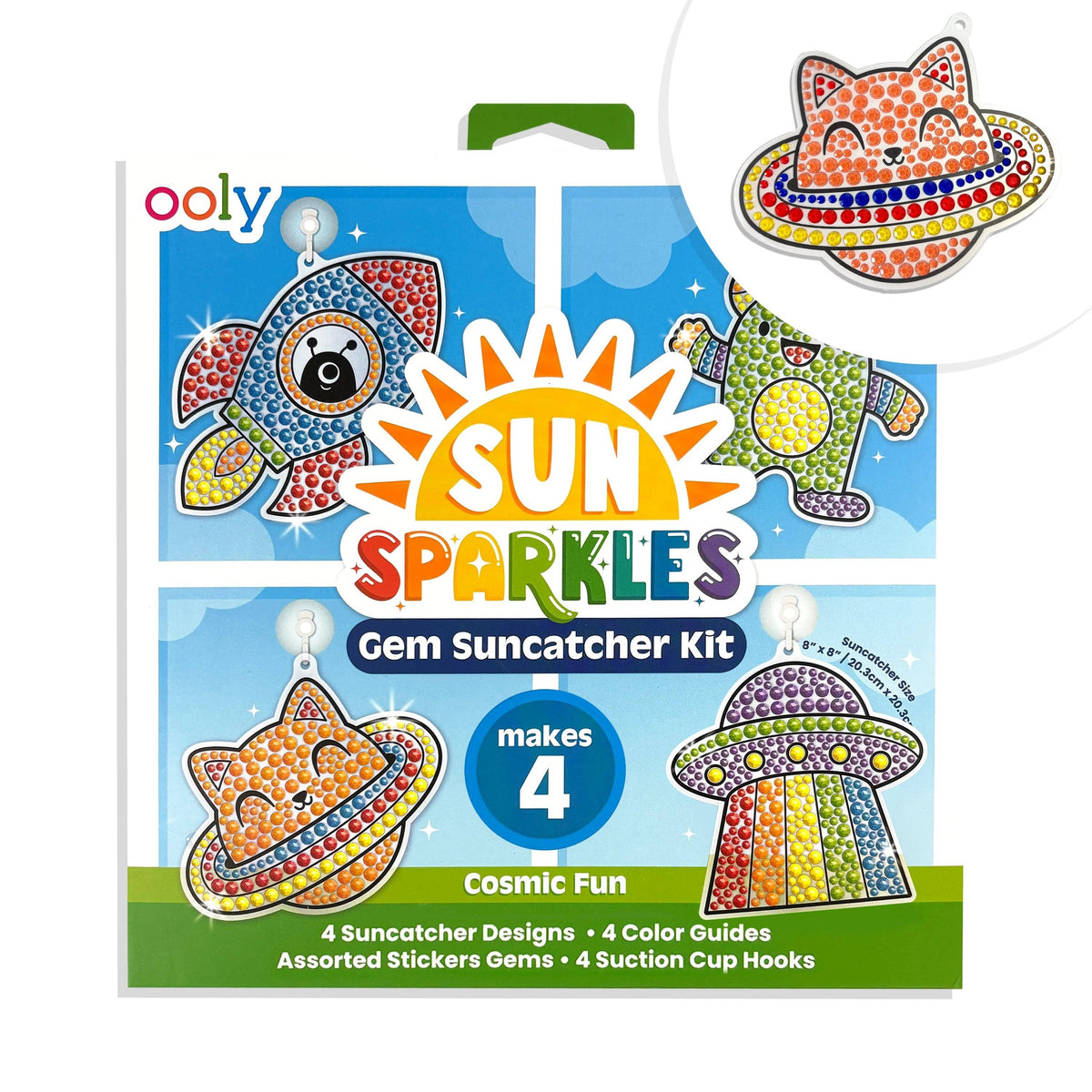 OOLY Sun Sparkles Cosmic Fun Gem Suncatcher Kit front packaging showing completed gem rocket, alien, space cat with planet ring, and UFO suncatchers — "makes 4," ages 6+, 8"x8" — with close-up inset of completed space cat suncatcher