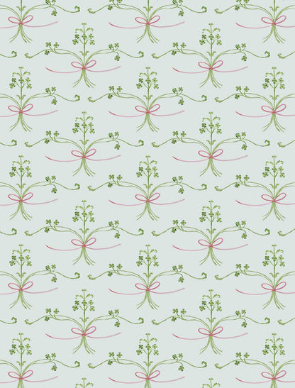 Helmsie wrapping paper sheet with botanical sprig pattern — delicate bunches of small floral sprigs tied with thin red string repeating on a light green background