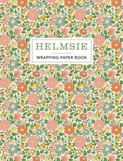 Helmsie Wrapping Paper Book cover with dense vintage floral pattern in pink, coral, yellow, and sage green on a cream background with "Helmsie Wrapping Paper Book" title in a white label