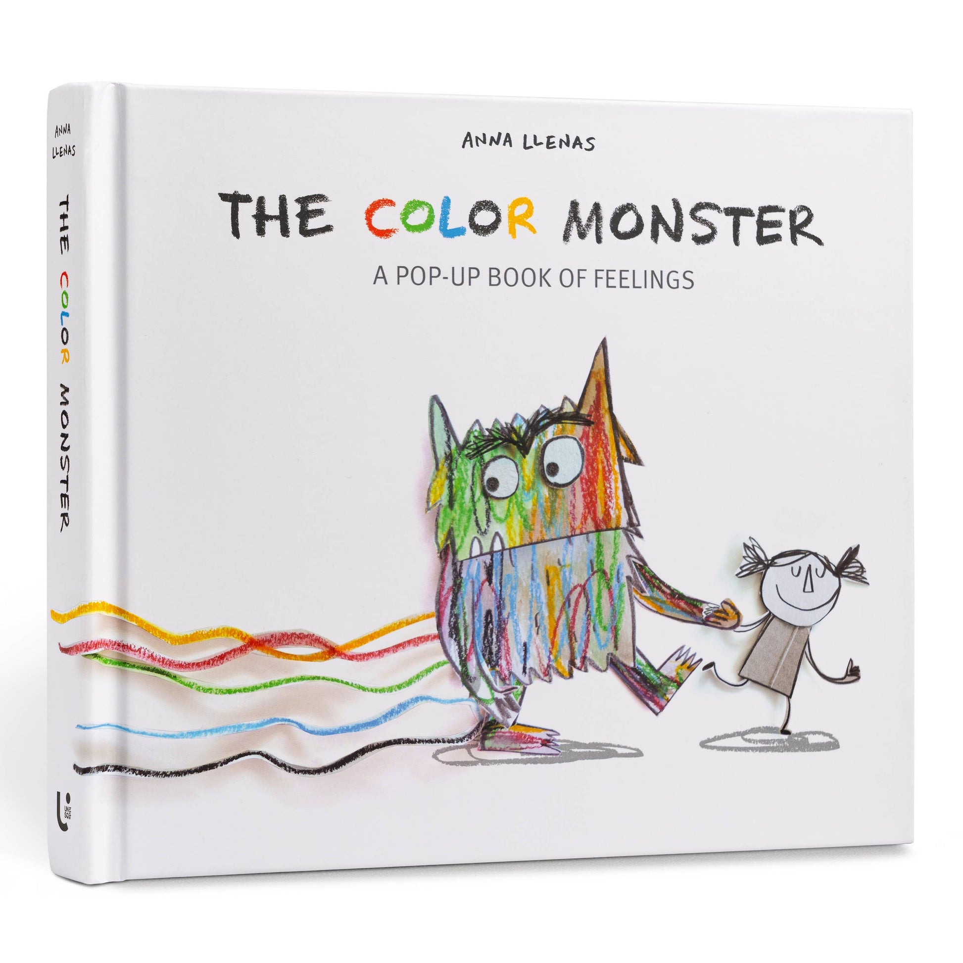 The Color Monster: A Pop-Up Book of Feelings hardcover cover by Anna Llenas — white cover with multicolor crayon-style title, a 3-D pop-up mixed-color monster holding hands with a sketched girl, and wavy yellow, red, green, blue, and black emotion lines trailing across the bottom, shown at an angle