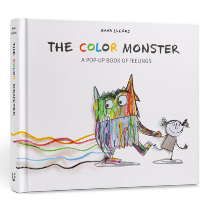The Color Monster: A Pop-Up Book of Feelings hardcover cover by Anna Llenas — white cover with multicolor crayon-style title, a 3-D pop-up mixed-color monster holding hands with a sketched girl, and wavy yellow, red, green, blue, and black emotion lines trailing across the bottom, shown at an angle