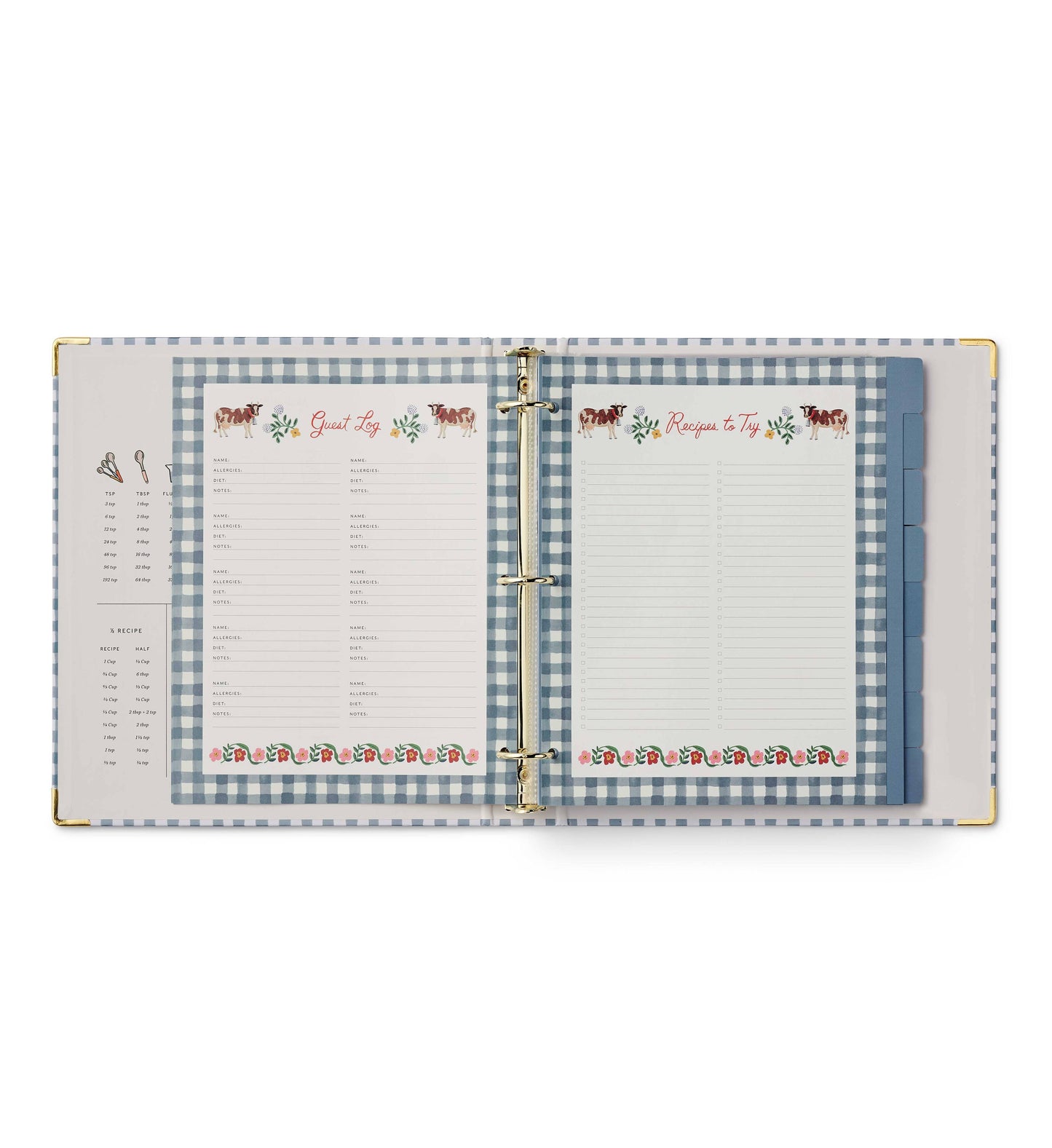 Rifle Paper Co. Home Sweet Home Recipe Binder open to Guest Log fill-in page on left and Recipes to Try fill-in page on right; both pages feature illustrated cow and floral borders with blue gingham binder background