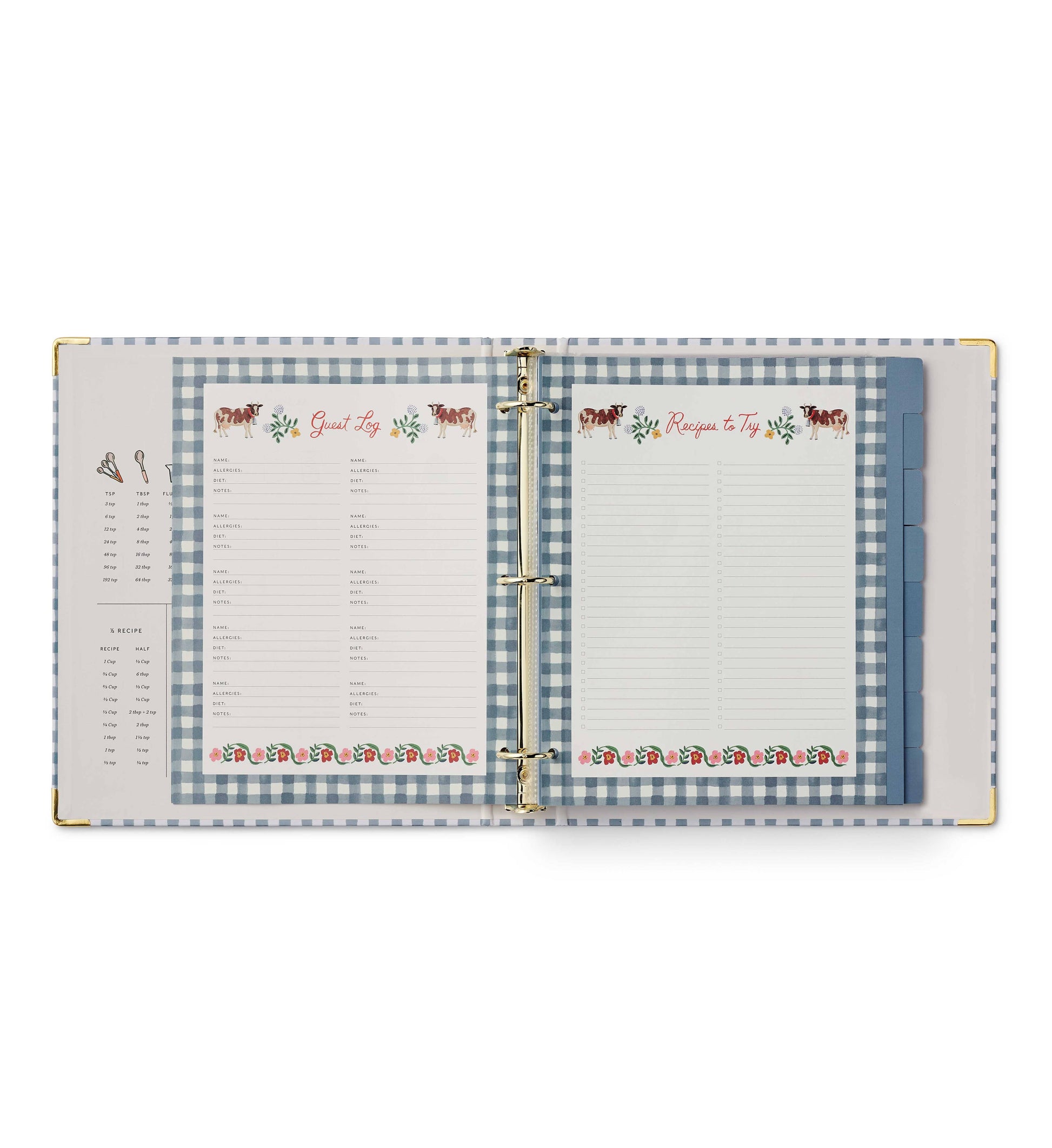 Rifle Paper Co. Home Sweet Home Recipe Binder open to Guest Log fill-in page on left and Recipes to Try fill-in page on right; both pages feature illustrated cow and floral borders with blue gingham binder background