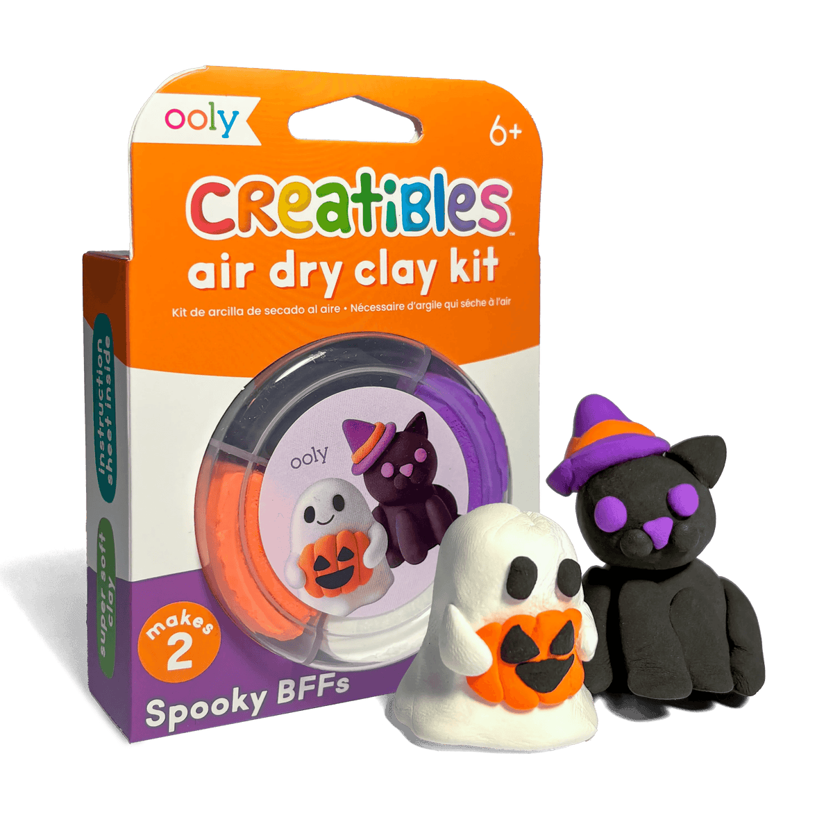 OOLY Creatibles Air Dry Clay Kit — Spooky BFFs front packaging showing completed ghost holding jack-o-lantern and black witch cat figurines alongside the round clay tub — "makes 2," ages 6+