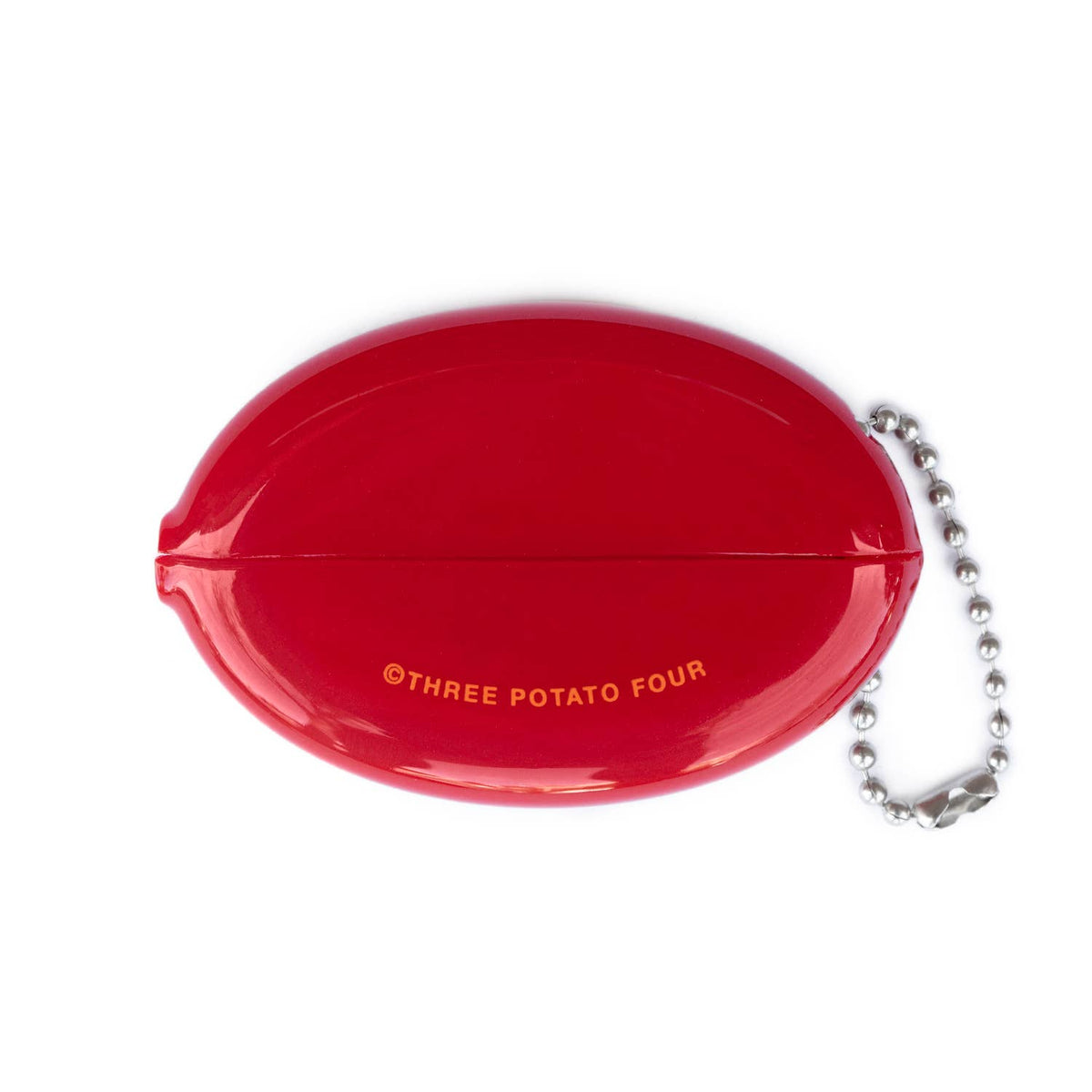 Back of Three Potato Four Pizza Money rubber coin pouch on white background — plain glossy red oval showing the horizontal squeeze seam line across the middle and "©THREE POTATO FOUR" printed in small orange text at lower center; silver ball chain attached at right