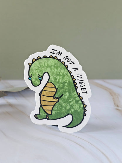 Sad Dino Nugget Vinyl Sticker Cute Green Dinosaur - Waterproof sticker for Water bottle, UV sealed