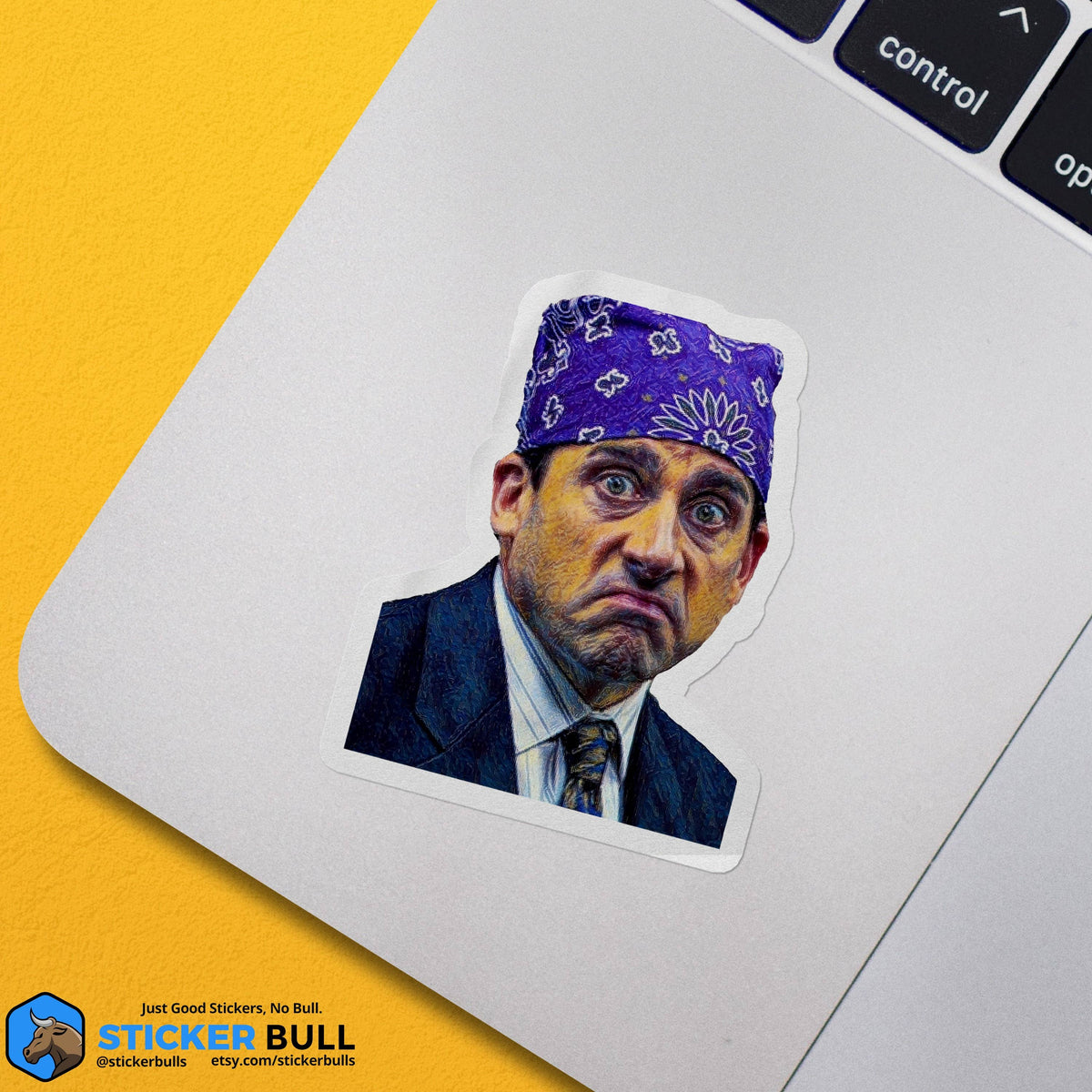 Sticker Bull Prison Mike The Office die cut vinyl sticker applied to a silver MacBook keyboard trackpad area against a yellow background — illustrated Michael Scott as Prison Mike in purple bandana; Sticker Bull logo in corner