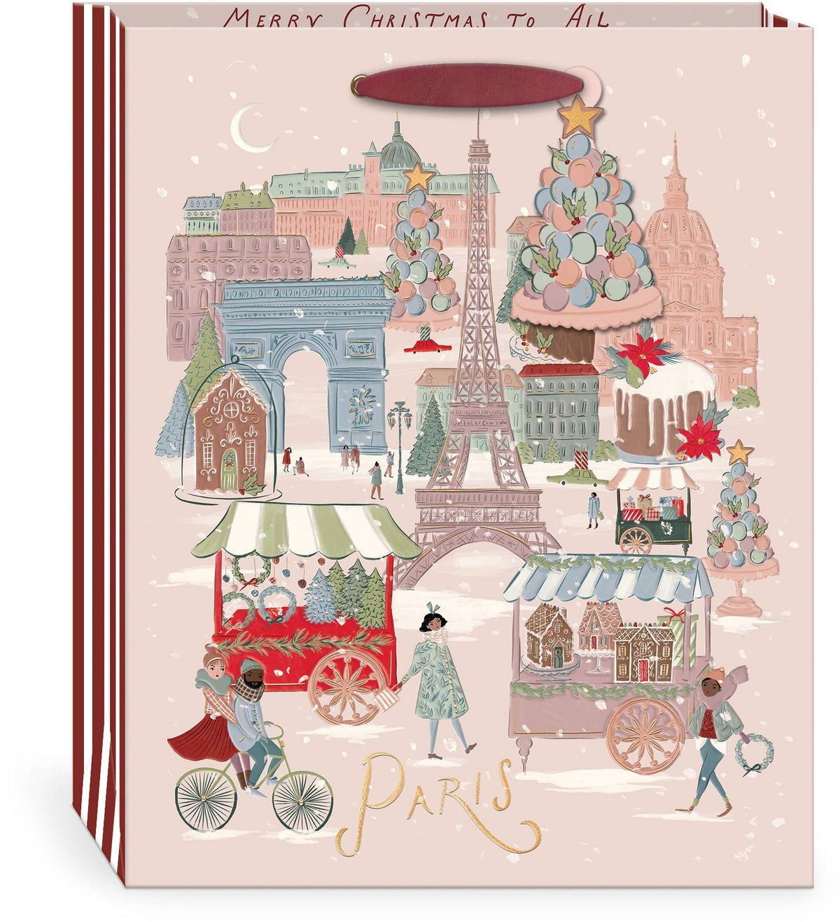 Punch Studio Joy to the World Paris Christmas large gift bag on white background — blush ground with detailed illustrated winter Paris scene: Eiffel Tower, Arc de Triomphe, and Haussmann buildings in snowfall; Christmas market carts with wreath and gingerbread sellers; figures cycling and strolling; decorated macaron and layer cake towers; gold foil script "Paris" at bottom; "Merry Christmas to All" text along top border; red and white striped sides; deep cranberry ribbon handle