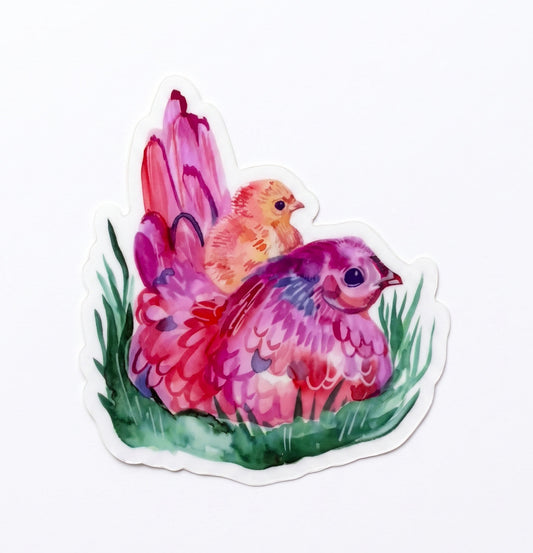 Made by Shellie Mama Hen and Baby Chicken vinyl sticker — vibrant watercolor mama hen in rich pinks, purples, and reds nestled in green grass with a tiny fluffy yellow baby chick perched on her back; die-cut with white border; white background