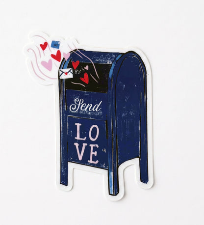 Made by Shellie City Mail Box with Hearts vinyl sticker — navy blue city mailbox with "Send" and "LOVE" in white script, overflowing with red and pink floating hearts and a love letter envelope; die-cut with white border; white background