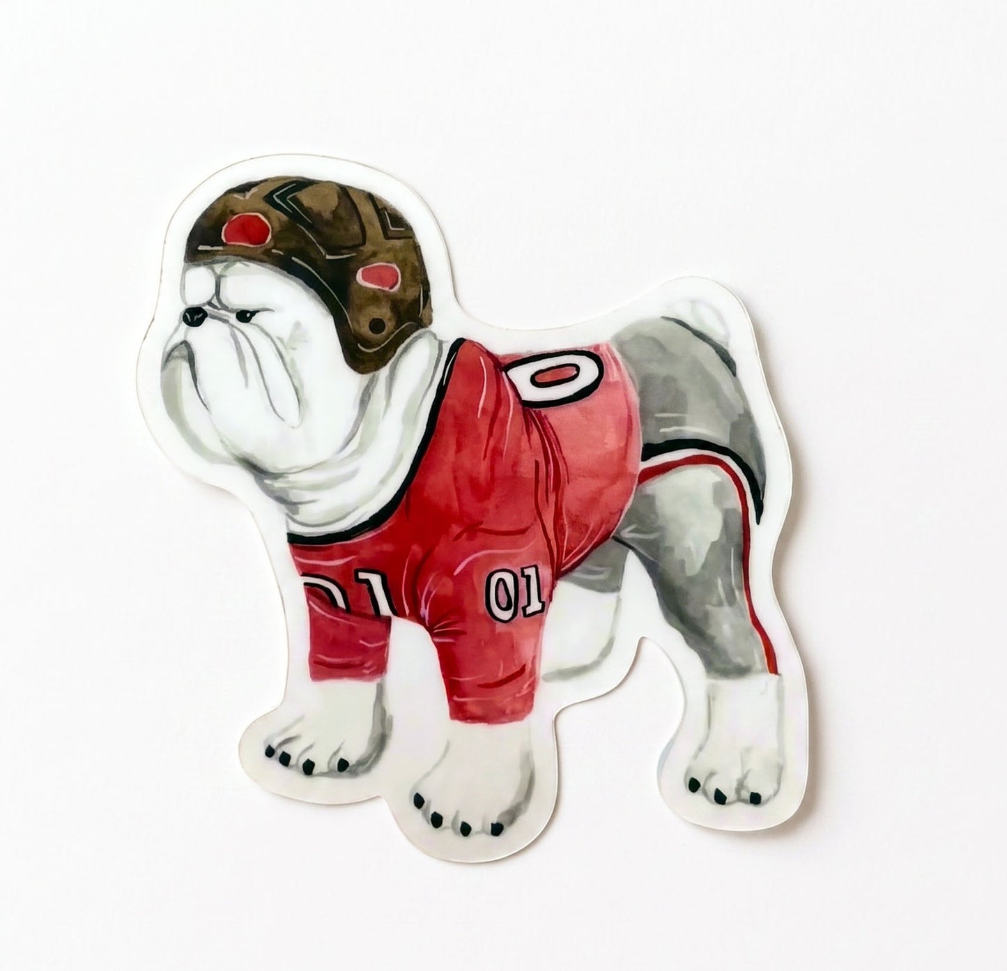  Made by Shellie Vintage UGA Bulldog vinyl sticker — watercolor English bulldog in vintage brown leather football helmet and red "01" jersey; die-cut with white border; white background